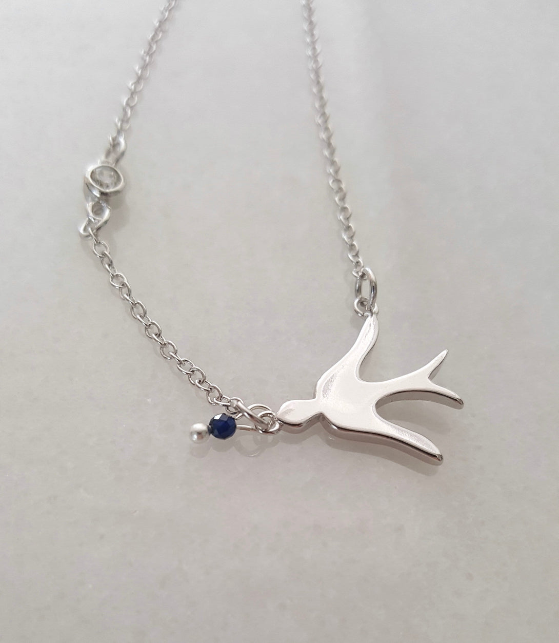 Sterling Silver Bird Necklace With Lapis Bead, December Birthstone Jewellery