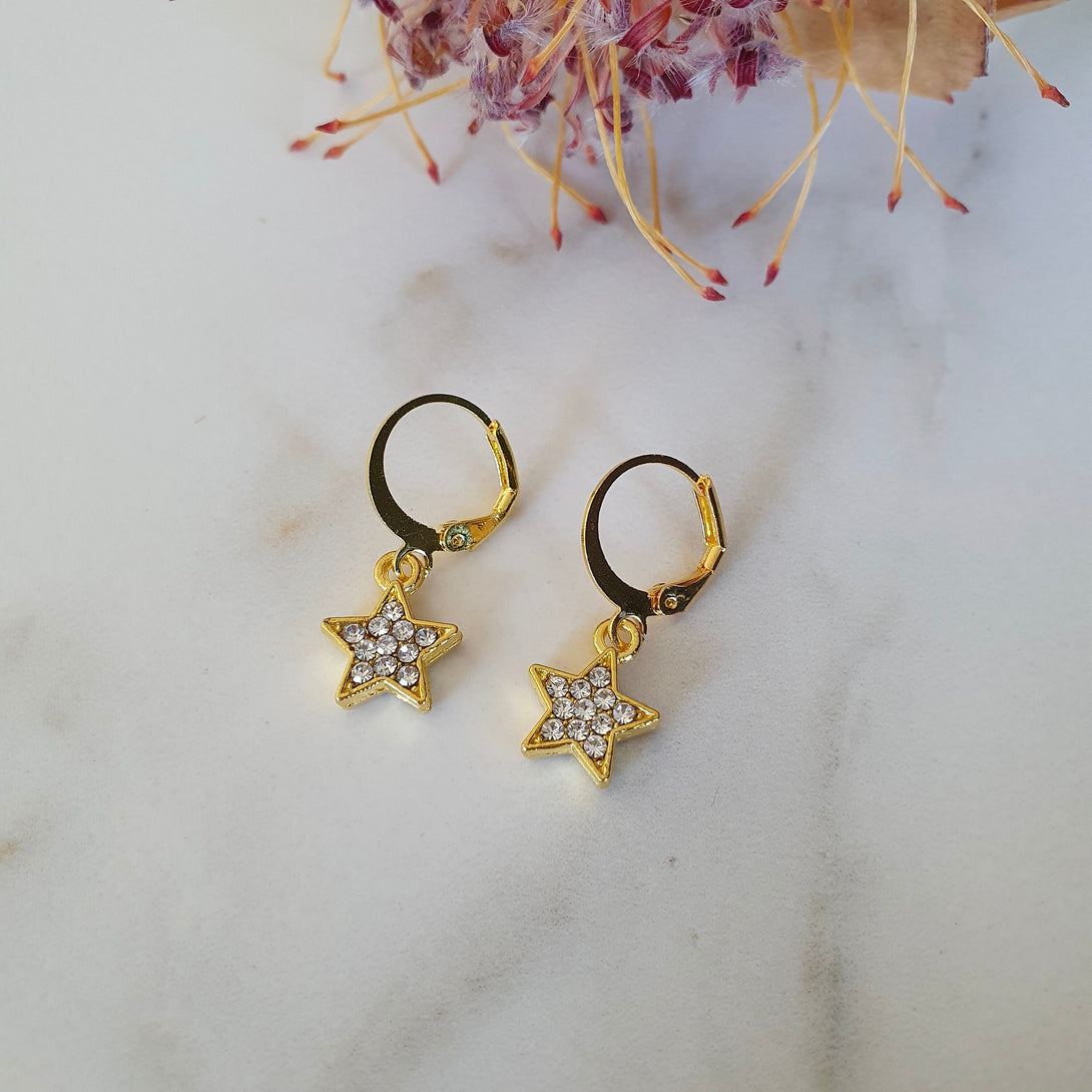 Pair Of Mini Star Huggie Earrings In Sterling Silver, Light Weight Hoops