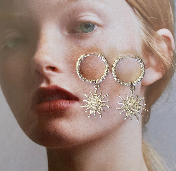 Titanium Hoops With Sun Charms, Symbolic Jewellery