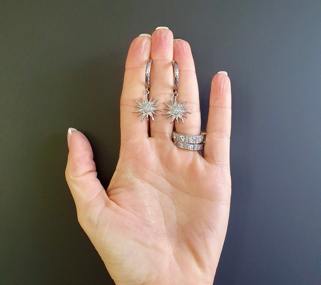 Titanium Hoops With Sun Charms, Symbolic Jewellery