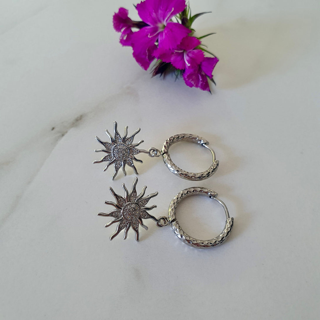 Titanium Hoops With Sun Charms, Symbolic Jewellery