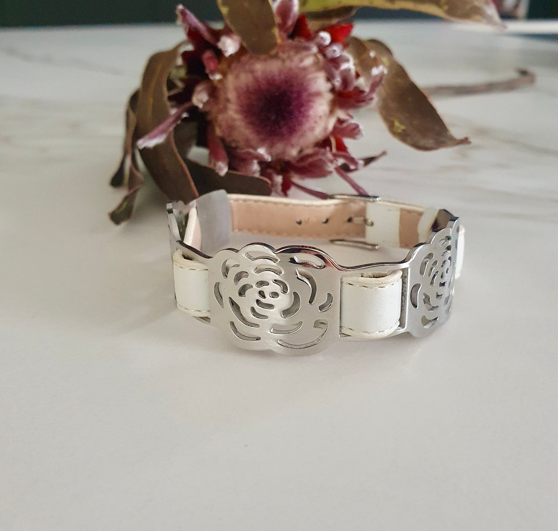 Adjustable White Leather Strap Bracelet with Cut-Out Stainless Steel Camellia Flower Design